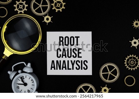 RCA Root Cause Analysis text message on sticky note with magnifying glass and alarm clock on black background