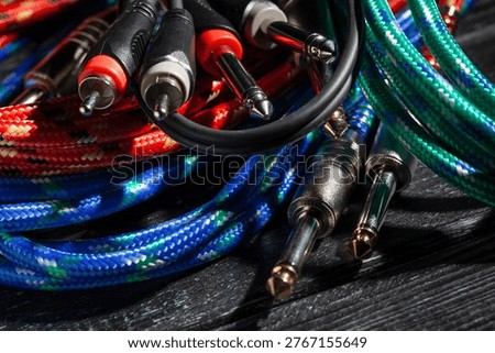rca ts audio cable on black wood background