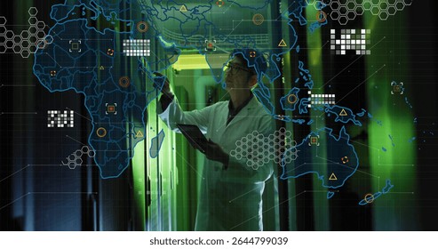 Reaching Korean engineer wearing lab coat holding tablet in green data center corridor, network map. Technology, innovation, cybersecurity, network, connectivity, futuristic, professional