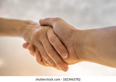 Reaching out to help a friend. Giving helping hand and support to someone in need concept.  - Shutterstock ID 1823463782