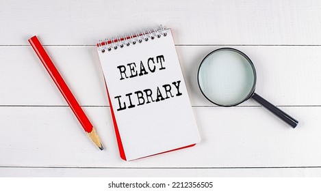 REACT LIBRARY Text On A Notebook On White Wooden Background , Business Concept