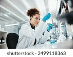 Reaction, science and solution with woman in laboratory for breakthrough, innovation or research. Beaker, liquid and pharmaceuticals with scientist at work on cure, medicine or vaccine development