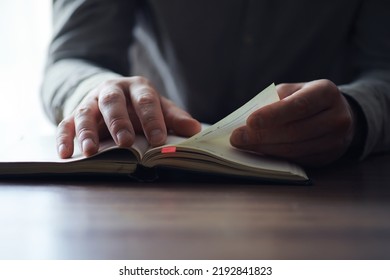 Read book. A man sits and reads literature. Textbooks study. Religion. - Shutterstock ID 2192841823