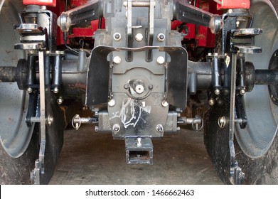 Read End Of A Tractor Showing The PTO Shaft And Three Point Hitch Area Where Implements Attach To The Tractor. Category Two Style Of Three Point Hitch.