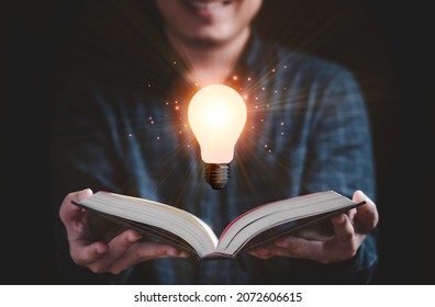 Reader open book with floating glowing light bulb for reading education , knowledge and creative think idea concept.