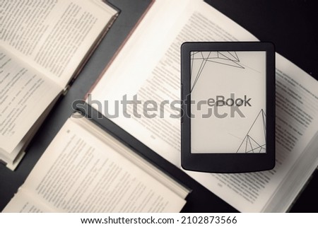 Readers. Digital e book, library reader tablet with books on dark background. Ebook, e learning electronic internet mobility concept