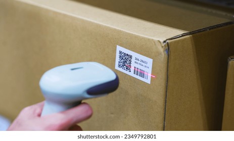 Reading barcode with barcode reader. - Shutterstock ID 2349792801