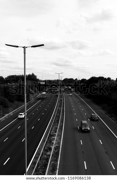 Reading,\
Berkshire, England - August 30, 2018: monochrome M4 motorway at\
junction 12, road run between London and Wales and is the busiest\
in Europe and known as the m4\
corridor