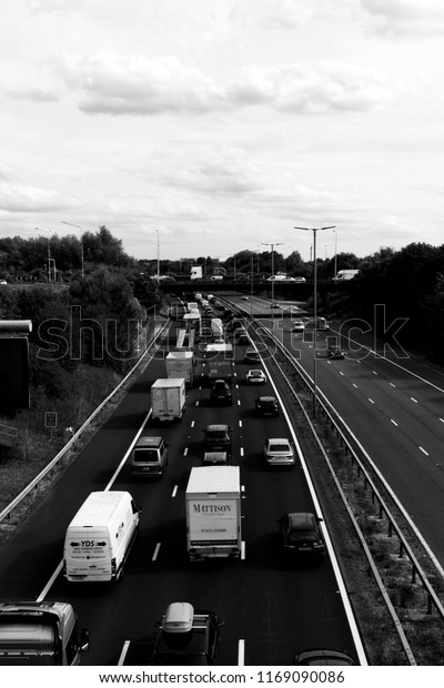 Reading, Berkshire, England - August 30, 2018:\
monochrome traffic jam due to accident on M4 motorway at junction\
12, road runs between London and\
Wales