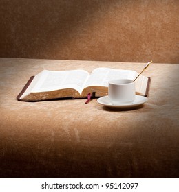 Reading The Bible With Cup Of Coffee