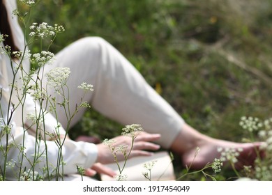 Reading in a flower meadow - Shutterstock ID 1917454049