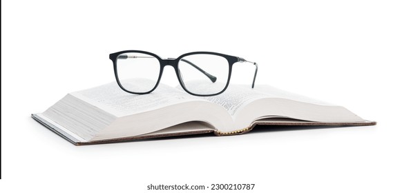 The reading glasses on opened book isolated on the white background. - Powered by Shutterstock