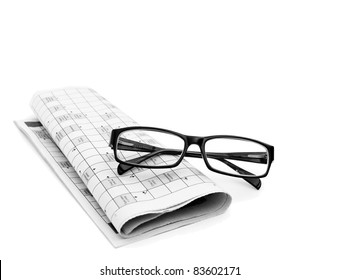 Reading Glasses Sitting On A Newspaper With A Narrow Depth Of Field.