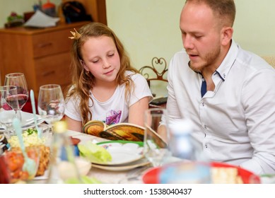 Reading The Haggadah, Jewish Family At Feast Of Passover. Selective Focus On Cute Girl.