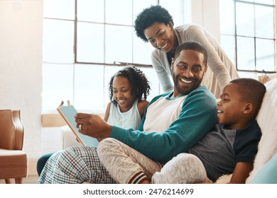 Reading, happy and black family with story on sofa for bonding together on fathers day at home. Smile, knowledge and African parents relaxing with children in living room with fantasy book or novel. - Powered by Shutterstock