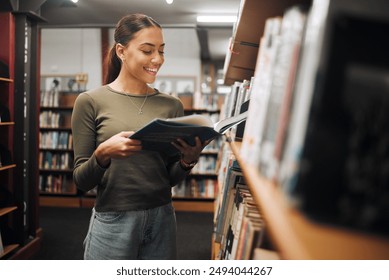 Reading, library book and woman student with a smile about learning, books and college study. University, education and happy woman with research, scholarship and studying report for a knowledge test - Powered by Shutterstock