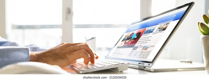 Reading News Article Headline On Laptop. Online Website