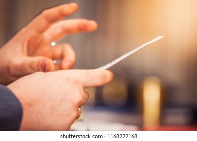 Reading notes in front of audience
