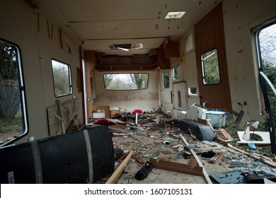 READING, UK - JANUARY 1, 2019: Litter, broken glass and wood inside an abandoned caravan in Reading, Berkshire, UK. - Shutterstock ID 1607105131