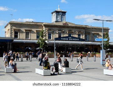 Reading, United Kingdom - June 22 2018:   Pedestrians and commuters pass by the three Guineas Pub by Reading Station