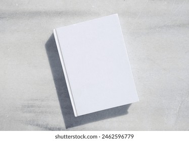 reading at vacation. blank book for mockup design on marble table - Powered by Shutterstock