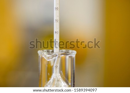 Reading the value from a hydrometer. Used for determining the specific gravity of liquids including beer. 