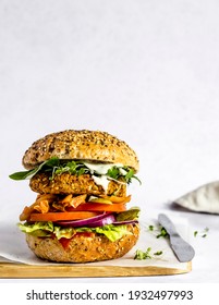 Ready To Be Served And Eaten, Freshly Made Vegan Burger Made Of Homemade Chickpea Patty, Served With Ketchup And Mayo, Lettuce, Tomato, Red Onion, Spinach, Gherkin, Micro Herbs And Kimchi. 