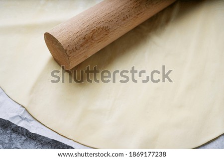 Roll out the dough with a rolling pin