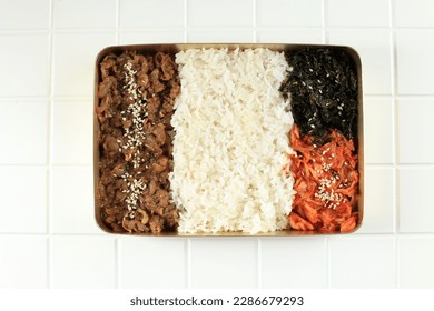 Ready to Eat Asian Korean Packed MEal Catering on Metal Box. Rice with Beef Bulgogi, Laver, and Kimchi