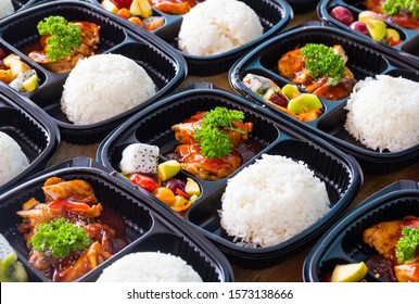 Ready to eat asian rice box, Thai food in take away plastic boxes. - Shutterstock ID 1573138666