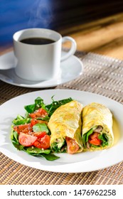 Ready To Eat Healthy Nutritional Low Carb Breakfast Or Lunch - Paleo Keto Style - Vegetable Omelette Burrito/wrap With Spinach, Avocado And Cherry Tomatoes, Served With Green Salad And Coffee. 