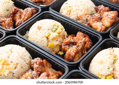 Ready To Eat Modern Asian Rice Box, Japanese Bento Box, Japanese Food Lunch Boxes In Plastic Packages. Fried Rice With Teriyaki Chicken.