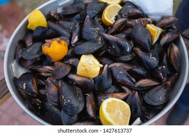 Ready To Eat Mussels Stuffed With Spicy Cooked Rice And Lemon. Concept Of Street Food In Mediterranean Region. Traditional Nutrition For Turists In Turkey Country. Horizontal Color Photography.