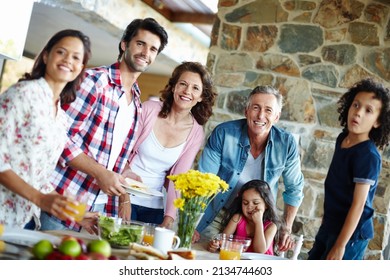 Ready To Enjoy A Family Meal. A Happy Family Enjoying A Meal Time Together.