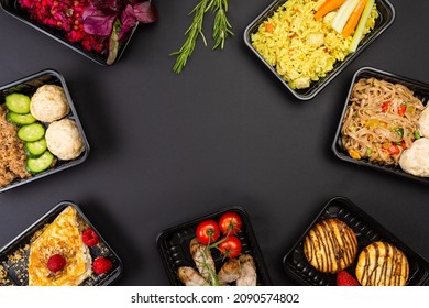 Ready healthy food catering menu in lunch boxes meat and vegetable packages on black table background