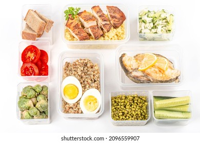 Ready healthy food menu in lunch boxes with fish, chicken, porridges and vegetables.