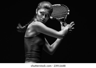 Ready To Hit! Female Tennis Player With Racket Ready To Hit A Tennis Ball.