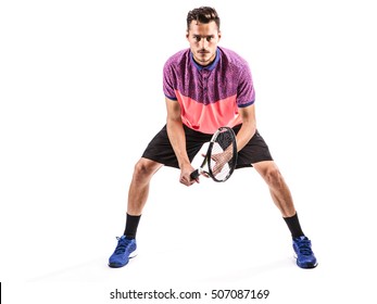 Ready to hit! Male tennis player with racket ready to hit a tennis ball isolated on white - Powered by Shutterstock