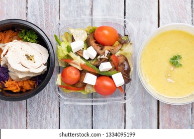 Ready Meal To Eat Inside Plastic Food Boxes On Wooden Table, Asian Salad