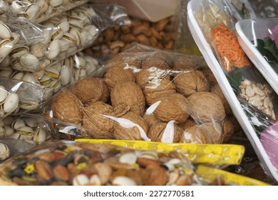 Ready packed various type of nuts at Arked Niaga, Padang Besar in selective focus and blurry.