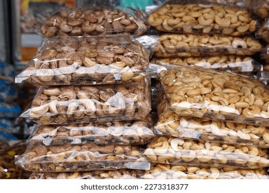 Ready packed various type of nuts at Arked Niaga, Padang Besar in selective focus and blurry.