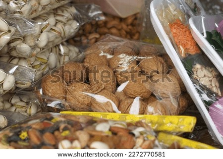 Ready packed various type of nuts at Arked Niaga, Padang Besar in selective focus and blurry.