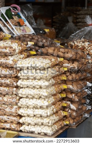 Ready packed various type of nuts at Arked Niaga, Padang Besar in selective focus and blurry.