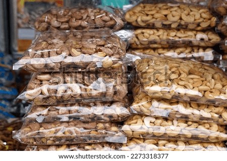 Ready packed various type of nuts at Arked Niaga, Padang Besar in selective focus and blurry.