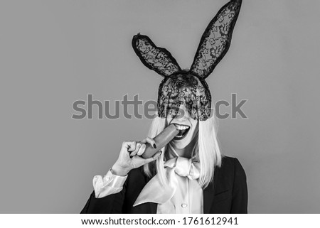 Similar – Young woman wearing rabbit ears and kissing