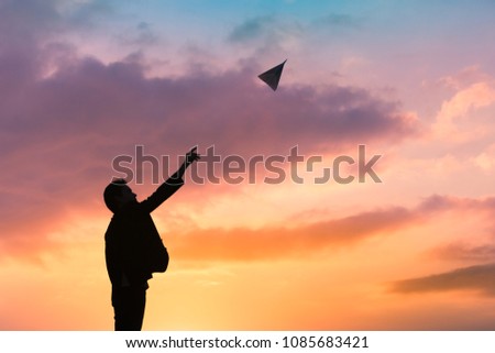 Ready set take off. Man launching paper airplane into the sky. 