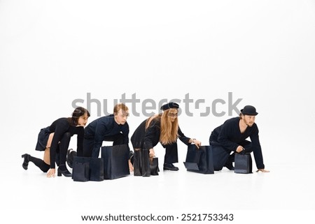 Ready, steady, go. Competition for big sale offer. Group of people all in black clothes showing readiness to run, isolated on white background. Concept of shopping, sales, Black Friday, fashion