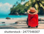 Ready for a Summer vacation. Red Suitcase at The Tropical Beach with Straw Hat. Summer vacation