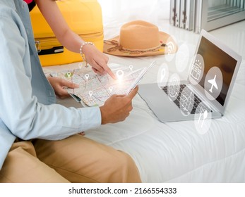 Ready To Trip And Vacation Plan Concept. Close-up Location Icons Virtual On City Map Near Laptop Computer Pointing By Couple With Travel Information Icon On The Bed. Travel Planning On Summer Holiday.