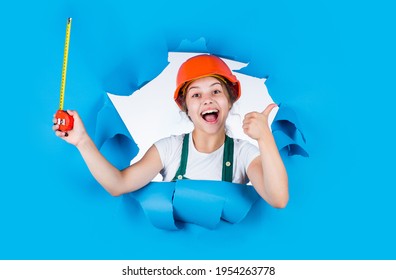 Ready To Work. Future Engineer. Happy Kid Use Tape Measure Repairing Tool. Building Construction Site. Child Architect Worker. Labor Day Concept. Childhood Development. Teenager Girl Assistant